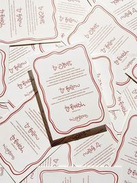 Hand lettering and custom illustrated border on wedding menus