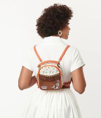 This delightful mini backpack in collaboration with Looney Tunes, is crafted in a sturdy leatherette and features a character print on the top and faux brown suede with sweet fringe, star studding, and an embroidered Bugs Bunny not he bottom. Removable and adjustable straps and a top handle provide versatile carry while a top zipper opens to a fabric interior!