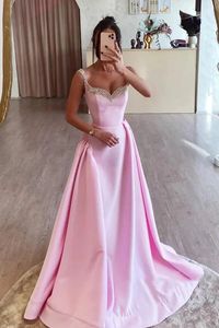 Expertly crafted with a candy pink A-line design and adorned with delicate beading, our Sleeveless Party Prom Dress will make you the center of attention. Designed to flatter any body type, this dress is perfect for any special occasion. Make a statement with our stunning and elegant dress.