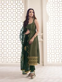 This great winter ensemble from Malaika Arora is perfect for your next special occasion. It includes a bottle green kurta set crafted from silk blend brocade, cotton and organza. Featuring Zari woven designs, a U-neck and calf length trousers, this set is sure to make a statement. It is dry clean only and designed specifically by the Bollywood Diva herself. TOP: Silk Blend(Brocade), TOP INNER: Cotton, BOTTOM: Cotton, DUPATTA: Organza, Dry Clean