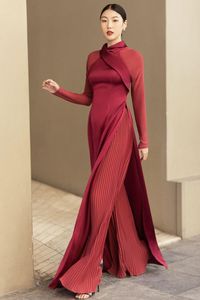 Indulge in luxury with our Ao Dai. Made from the finest silk chiffon, this elegant dress features a flattering A-line silhouette and long sleeves for a touch of sophistication. Perfect for any formal occasion, this dress will make you feel elegant and exclusive.