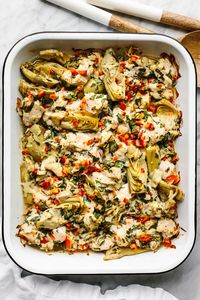 This spinach artichoke chicken bake is savory, cozy, and layered with loads of chicken and veggies for the perfect all-in-one meal prep dish.