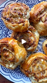 My First Meals | Grace Mortimer on Instagram: "Cheesy Sausage Pinwheels 
.
.
.
INGREDIENTS:
1 sheet of puff pastry 
6 sausages 
2 tbsp wholegrain mustard 
1 onion 
1 handful of grated cheddar 
.
METHOD:
Turn the oven to 180 c fan.
Roughly slice the onion and add it to a frying pan on a medium heat with a good drizzle of oil or butter and fry until soft and golden.
Lay the puff pastry out flat and cover with a thin layer of the mustard.
Squeeze the sausages out of their skins and spread the sausage mixture evenly on top of the mustard.
Spread the onion across the top and finally sprinkle over the grated cheddar.
Roll the pastry into one long sausage (not tightly or you’ll have raw pastry) and slice into even disks.
Place them on a lined tray, brush with either egg or milk and bake at 180 fo