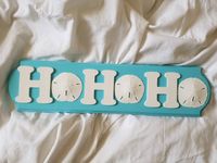 "The wooden decor sign measures approximately 24\" x 6\" with picture hangar hooks for easy hanging. This is the cutest little sign to accent your coastal Christmas theme!. This makes a great gift for the loved one in your life with a beach cottage or coastal themed room. This sassy little sign can be hung anywhere you want to feel like channeling the ocean and Christmas all at the same time! Need a color that you don't see? Send me a private message and I can do a special order color of your ch