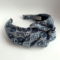 Headbands for women knotted BlueTop knot turban headband 40's vintage style  hairband hair accessories no slip stay on knotted head band for womenThis headband is a modern take on a vintage classic. Glamorous yet practical top knot style is a perfect stand out hair accessory. This headband features: 100% woven cotton fabric by Moda. It’s a faded blue with a lovely tile pattern. No slip stay on construction perfect for all hair types and styles including short pixie cuts! A fixed knot that never