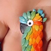 NOON FLOWER studio [Christine] on Instagram: "These gorgeous little ones are as satisfying to make as blooms! Dedicated to a wonderful human who’s going through a rough patch. Sending her strength and good vibes xx #parrot #parrotearrings #birdearrings #birdsofinstagram #polymerclay"