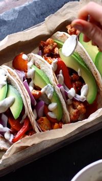 Colourful, easy to make, and bursting with flavour: that is what these BBQ cauliflower and chickpea-filled tortillas are all about. The smokey marinade pairs especially well with the garlicky sauce and crispy red onions.