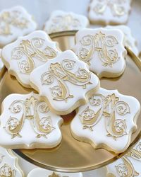 monogrammed white and gold wedding cookies