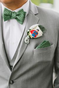 This groom was so creative with his boutonnieres! He asked that each groomsman tell him their favorite superhero, then he got a lego version of each one for their specific boutonniere :). I love unique, personal touches like this on a wedding day! It makes the day so special and "you" :). Photo by Emily Tebbetts Photography.