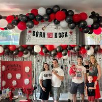 Rock n roll theme baby shower. Red metallic black and white balloons, diaper pong, temporary tattoos, band shirts