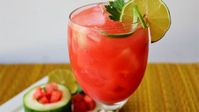 This watermelon and lime agua fresca is a refreshing Mexican-style drink served in tall glasses over ice, perfect for a hot summer day.