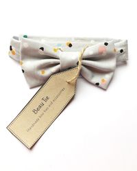 Children’s bow tie, handmade using grey cotton with a multi colour spot print. #kidsbowtie #childrensbowtie #babyshowergift #babybowtie #boysbowtie #pageboy #multicoured #greybowtie