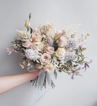 Bouquets: The style of this bouquet is lovely. I think the blush colour is nice and would go well with more blues/greenery