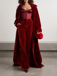 Sergio Hudson's wide-leg pants made a statement on the Fall '24 runway, where they were styled with the matching trench coat. They're tailored from plush velvet in a bold 'Scarlet' hue and have subtle pleats at the waistband.