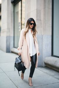 A tie neck blouse, faux leather leggings and a neutral pink/blush overcoat