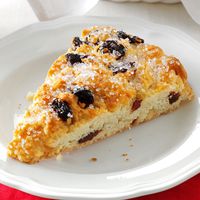 These buttery scones dotted with dried cherries and vanilla chips are so sweet and flaky that I sometimes serve them for dessert. —Pam Brooks, South Berwick, Maine