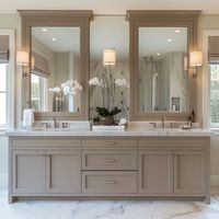 A California style interior design showcases satin nickel faucet designs in the bathroom, creating a cohesive look