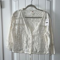 Beautiful Free People Ivory Embroidered Blouse Deep V Neckline Trimmed In Delicate Crochet Trim Floral Embroidery Snap Front With Drawstring Waist 3/4 Elastic Sleeves 200% Cotton Size L Measurements Pit To Pit- 24” Length Underarm To Hem- 10” Length Shoulder To Hem- 20” New With Tags Msrp $68