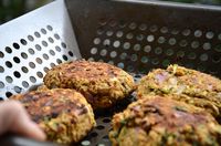 These spicy chickpea veggie burgers can be ready in less than 30 minutes! Make them on the BBQ or fry them in a pan for the perfect summertime dinner.