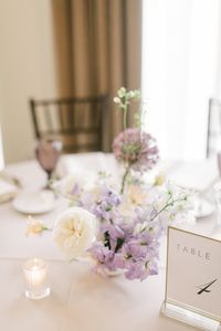 Spring, gardenesque floral centerpiece. Milwaukee wedding at The George. Photography by Autumn Silva.