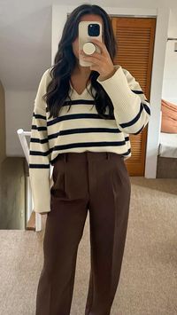 Striped sweater | fall fashion | brown trousers | outfit ideas | outfit inspo | winter fashion | minimalist outfit | casual outfit | brown pleated pants | brown wide leg pants | brown trousers | stripe sweater | airport outfit