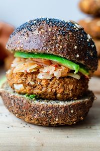 These hearty tempeh, quinoa, and sweet potato burgers are oh so satisfying. They're packed with so much protein and flavour, no one will miss the meat! You can add a variety of toppings, including kimchi, sauerkraut, avocado, cashew cheese, mustard, to these burgers for a fun dinner that everyone will love. #veggieburgers #healthyrecipe #tempeh #quinoa #sweetpotato