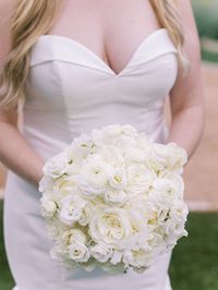 Traditional White Bridal Bouquet at Tapatio Springs | Lisianthus white, peony avalanche, ranunculus: elegance bianco, rose: playa blanca, spray rose-virgo, sweet peas white, tulips white | Photo by: Elizabeth Rey Photo | Tyler Fuller: Triple CHK Coordinator