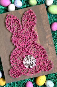 Make your own super cute Easter string art with this tutorial and free bunny template. It's so simple to make and will look great in any room!