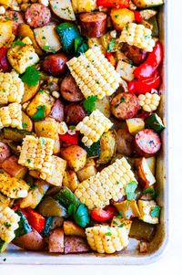 Sheet Pan Sausage and Veggies - The ultimate week night dinner complete with corn cooked right in the cob all done on a sheet pan! #sheetpan #onepot #dinner #recipe #sausage #corn #veggies #gluten-free #healthy #weeknight