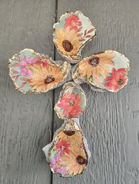 These shells are hand picked and painted. Trimmed with gold This item measures approximately 11 1/2" tall and 7" wide Each cross has a heavy duty hanger.