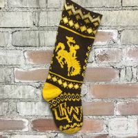 Knit this Brown and Gold Christmas stocking to hang on your own mantlepiece, or gift it to the biggest UW fan you know! Classic colorwork motifs are combined with iconic Wyoming symbols to create a fun and challenging knitted project. Each kit includes all of the yarn you'll need to knit one stocking, along with the pattern. The kit includes 100% wool yarn from the Brown Sheep Company located in Mitchell, Nebraska.