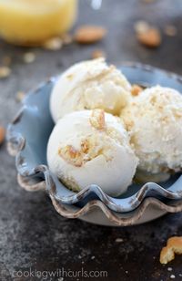 Sweet vanilla ice cream with swirls of lemon curd and vanilla wafers make this Lemon Cheesecake Ice Cream a delicious, frozen summer treat! #dairyfree #lemon #dessert