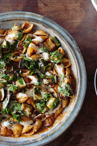 Charred aubergines add a smokiness to this rich vegan pasta dish, which is finished with a creamy tahini sauce, crispy, golden cubes of aubergine and fresh parsley.