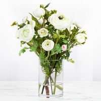 This classy real touch ranunculus flower arrangement centerpiece includes a variety of gorgeous silk ranunculus flowers in a glass vase for the perfect modern centerpiece. Add this elegant silk floral arrangement to elevate your home decor, perfect for a dining room table, bedroom, foyer table, coffee table, or in the living room for all to enjoy! #ranunculuscenterpiece #whitecenterpiece #whiteflowerarrangement #silkfloralarrangement #homedecor