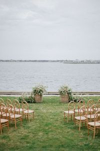 Brilliant Event Planning | Luxury Wedding and Event Planner - intimate wedding ceremony, coastal wedding ceremony, light wooden wedding ceremony chairs, spring wedding, summer wedding, new england wedding ceremony, east coast wedding ceremony Planner: @brillianteventplanning⁠ Floral/Event Designer: @victoriasamuel⁠ Venue: @thewauwinet ⁠ Photography: @stephanievegliante⁠ Cinematography: @willowtreefilms⁠ Rentals: @partyrentalltd, @maisondecarine, @latavolalinen, @theeventrental_co