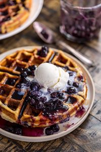 Greek Yogurt Blueberry Waffles with Fresh Blueberry Sauce - Baker by Nature