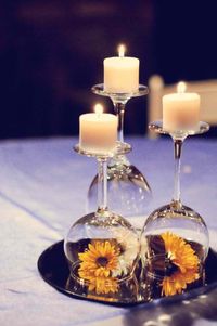 Simplicity. Wedding reception table decor. Wine glasses, candles, flowers and a mirror. Beautiful.