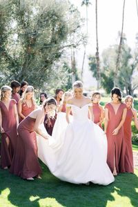 There’s no denying how gorgeous this bride is in her custom @barbarakavchokbridal dress, but can we talk about her gals in these stunning terracotta tones?! 😍 | ​Photography: @aliciaminkphoto #stylemepretty #weddingdress #weddinggown #bridesmaiddress #bridesmaids