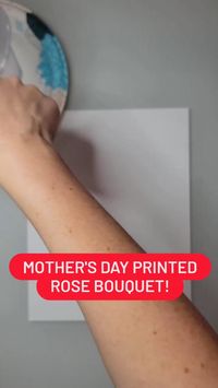 Difficulty: Easy     You will need: cardstock, red paint (or any other color you’d like to use to make your flowers), green paint, paintbrush, paper plate or paint palette, Ziploc bag (that's what we use) or other plastic bag with a sharp corner, rubber band or yarn, craft roll or paper toilet roll.  How you do it:  1️ Inflate a plastic bag, twist it shut, and tie it closed with a rubber band or piece of yarn. An easy way to inflate a bag is to blow in it with a straw.  2️ Pour red paint into a paper plate and gently push one of the corner of the bag into the red paint and then stamp that same corner on a piece of cardstock. This will make a flower! Keep stamping until there is no more paint on the bag and repeat. Note: if you don’t see the white in the flower, the paint is too thick, appl