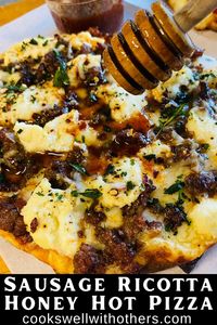 Sausage Ricotta Honey Hot Pizza is an easy at home pizza recipe using Naan flatbread as the crust, a sweet and spicy treat for the Traeger pellet grill or bake in the oven!