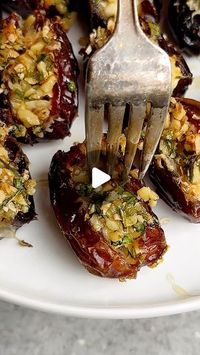 Caitlin Latessa-Greene on Instagram: "FETA-PARMESAN ROASTED STUFFED DATES WITH HONEY-WALNUT HERB CRUNCH! LEGIT THEY ARE MOUTHWATERING DELICIOUS!
•
For the topping:
1/3 cup walnuts, finely chopped 
1 tbsp finely chopped rosemary 
2 tbsp chopped scallions
2 tbsp chopped parsley or arugula
1/2 tbsp olive oil 
1/2 tbsp honey
1 tsp orange zest
1/4 tsp salt
Pepper to taste
•
10 oz Medjool dates, sliced open on one side
Honey 
3 oz feta cheese, sliced into 1 inch “pieces”
3/4 cup shredded Parmesan cheese 
•
1️⃣Preheat the oven to 375. 2️⃣Make the topping by adding all ingredients to a bowl and mixing. 3️⃣Add some honey to a small bowl and add the Parmesan to a small plate. Dip the feta into honey, then the Parmesan to coat. Add the feta to the center of the dates. 4️⃣Add the dates to a casserole 