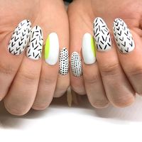 Abstract modern nail art! Long white nails with confetti like doodles on top. Add in a pop of neon yellow to make for a perfect spring time manicure! Click through for more spring nail art inspiration from Katie Masters aka Nail Thoughts