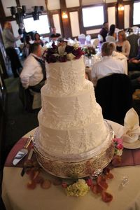 Our wedding cake had the Rocky Mountains carved into the frosting since we were married in Colorado. The first layer was strawberry creme, the second layer was butter pecan, and the top was red velvet.