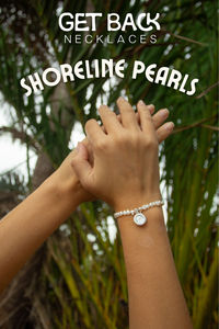 Our fan favorite Shoreline Pearl Bracelet now featured in Silver! Featuring a sleek Silver White St. Christopher pendant to protect you on all your coastal journeys. Adorned with luminous pearls, this adjustable bracelet is perfect for adding a splash of ocean-inspired excitement to your look.

-½” silver plated stainless steel St. Christopher pendant 

- 2"-5" adjustable string length

- Colored hard white enamel on outside rim  