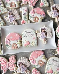 Kerstyn Lott on Instagram: "Fairy garden dreams for Charm’s Fairy first birthday Ah, I loved this set. Inspo provided was by @sunsetsweetsbyjess , @sarahscookiejar and @daisyanddoughbakingco Fairy design is from the invitation, and is handcut Party planned by Bouncerie #fairymushroom #fairycookies #fairycore #fairyaesthetic #mushroomhouse #mushroomcookies #decoratedcookies #cookiedecorating #cookiedesign #designercookies #cookieart #cookieartist #instacookies #cookieoftheday #dallascookies #dallasmoms #dfwcookies #friscocookies #friscomoms #mckinneycookies #mckinneymoms #confettiyeticookies"