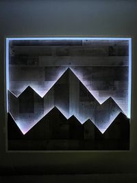 Lighten up your home with this two layer wood mountain wall art. The default colors for the mountains are gray and brown wood paneling with a white frame. The LED light strip has several color options, including holiday themes and rainbow. The LED light must be plugged into a wall.  If you are interested in a different size, color combination or materials for the mountains, or frame please message me. The sky is the limit!