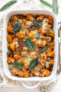 This butternut squash casserole has all the flavors of fall with apples, sweet sausage, caramelized fennel and onions, plus Gruyere cheese! | thecozyapron.com #butternutsquashcasserole #butternutsquashcasserolerecipes #butternutsquashcasserolehealthy #butternutsquashcasseroleeasy