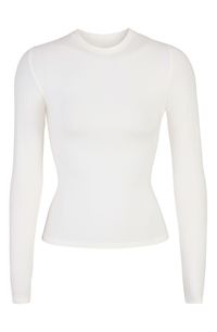 A tried-and-true classic, this fitted long-sleeve T-shirt cut from stretch-enhanced cotton jersey is from Kim Kardashian's highly sought-out SKIMS collection. 21" regular length (size Medium) Crewneck Long sleeves 90% cotton, 10% elastane Machine wash, tumble dry Imported