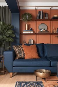 Experiment with this precise design and furniture in your own area using AI HomeDesign with just one click!Blue, Orange, Teal, Living room, Couch, Pillows, Color scheme, Palette, Tones, Dark, Vibrant, Cozy, Modern, Stylish, Complementary#LivingRoomDecor #TealAndOrange #ColorPalette #InteriorDesign #BlueAndOrange #HomeStyle #RoomInspiration #AIHomeDesign #ModernDecor #ColorScheme