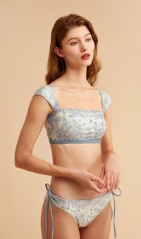 Shop GRACE vintage square-neck bikini set in light blue and floral print. Discover our selection of high waisted bikinis. Cute and modest two-piece swimsuits for women.